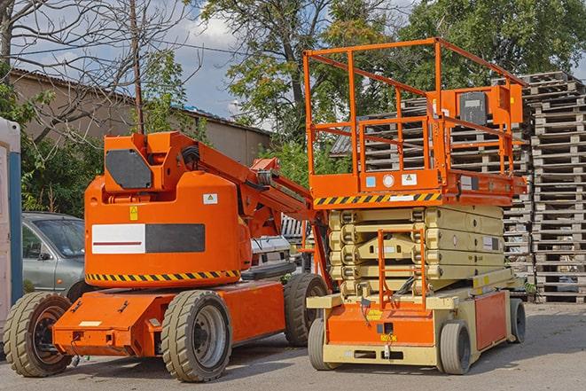 forklift carrying pallets in a busy warehouse in Bloomfield Hills, MI